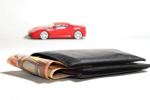 red car behind wallet